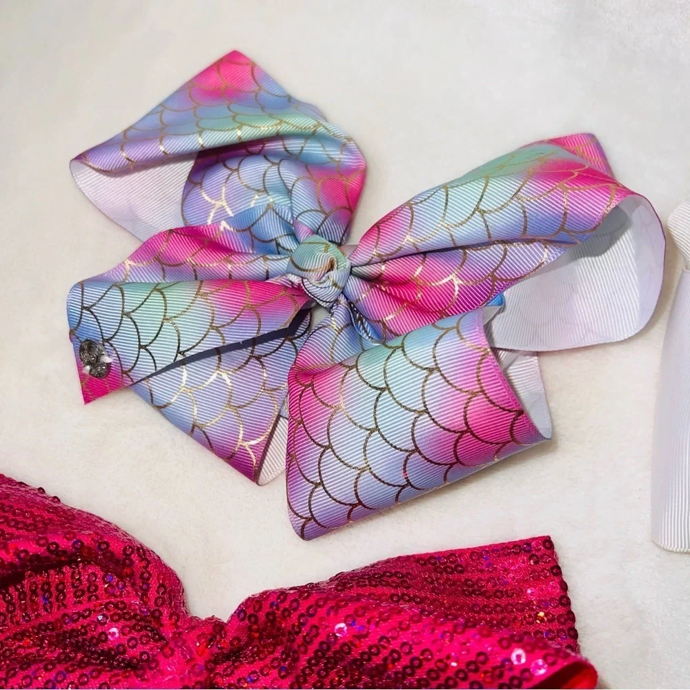 7 Cheerleader/Dance Bows Different Sizes, Colors & Holders. Missing Black Bow